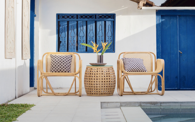 poolside view with 2 brown wicker chairs